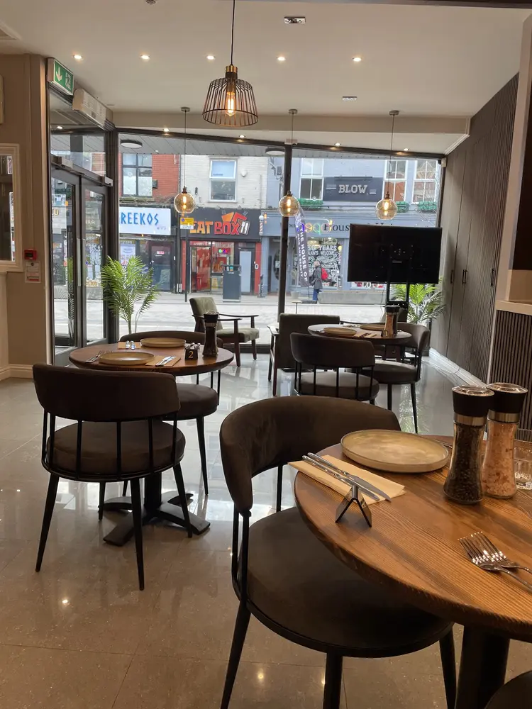 Window seats and wooden tables looking out onto Friargate